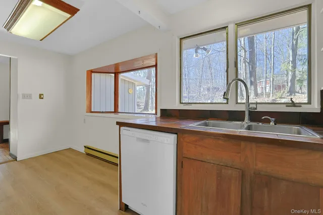 a kitchen with a sink and a window