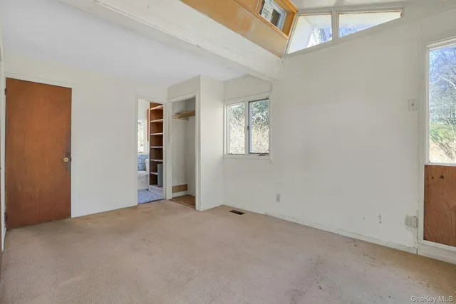 an empty room with windows