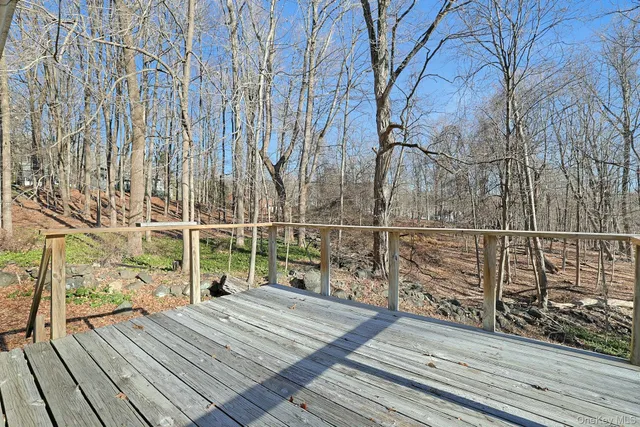 a view of wooden balcony with wooden floor