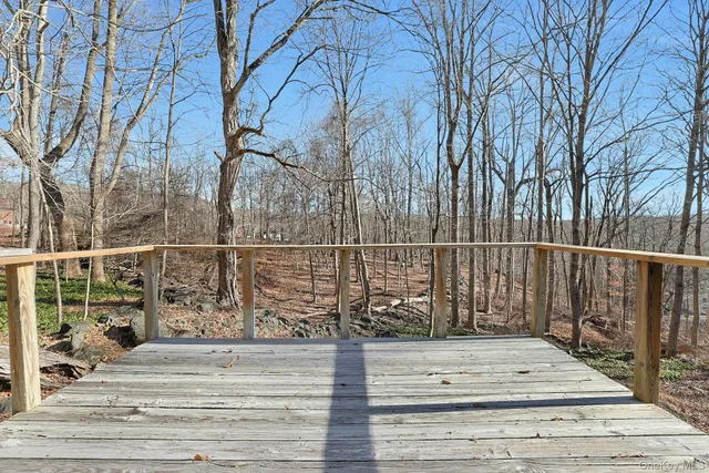 a view of wooden fence and a bench