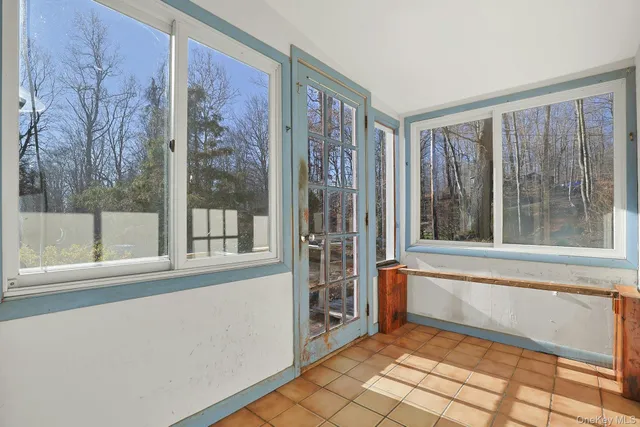 a view of a room with a large window