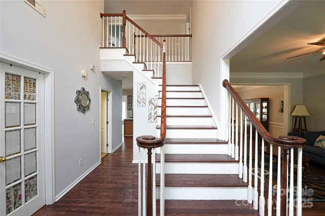 a view of entryway and hall with wooden floor