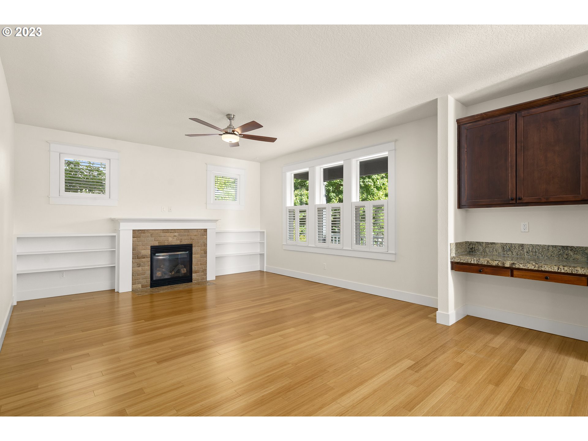 3917 Southwest Stephenson Street Portland, OR 97219 - Photo 17 of 34 a view of an empty room with window and wooden floor