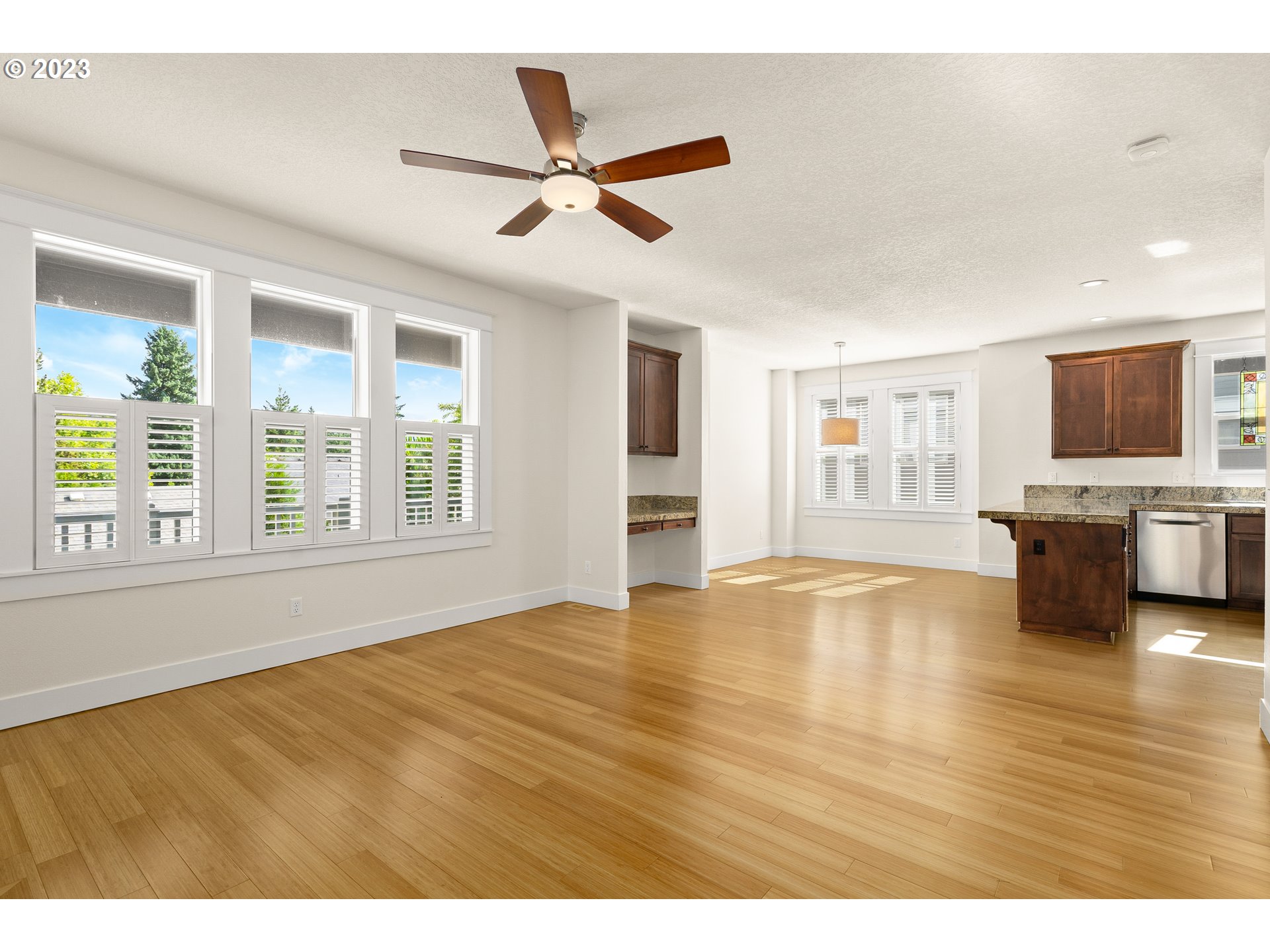 3917 Southwest Stephenson Street Portland, OR 97219 - Photo 18 of 34 a view of an empty room with window and wooden floor