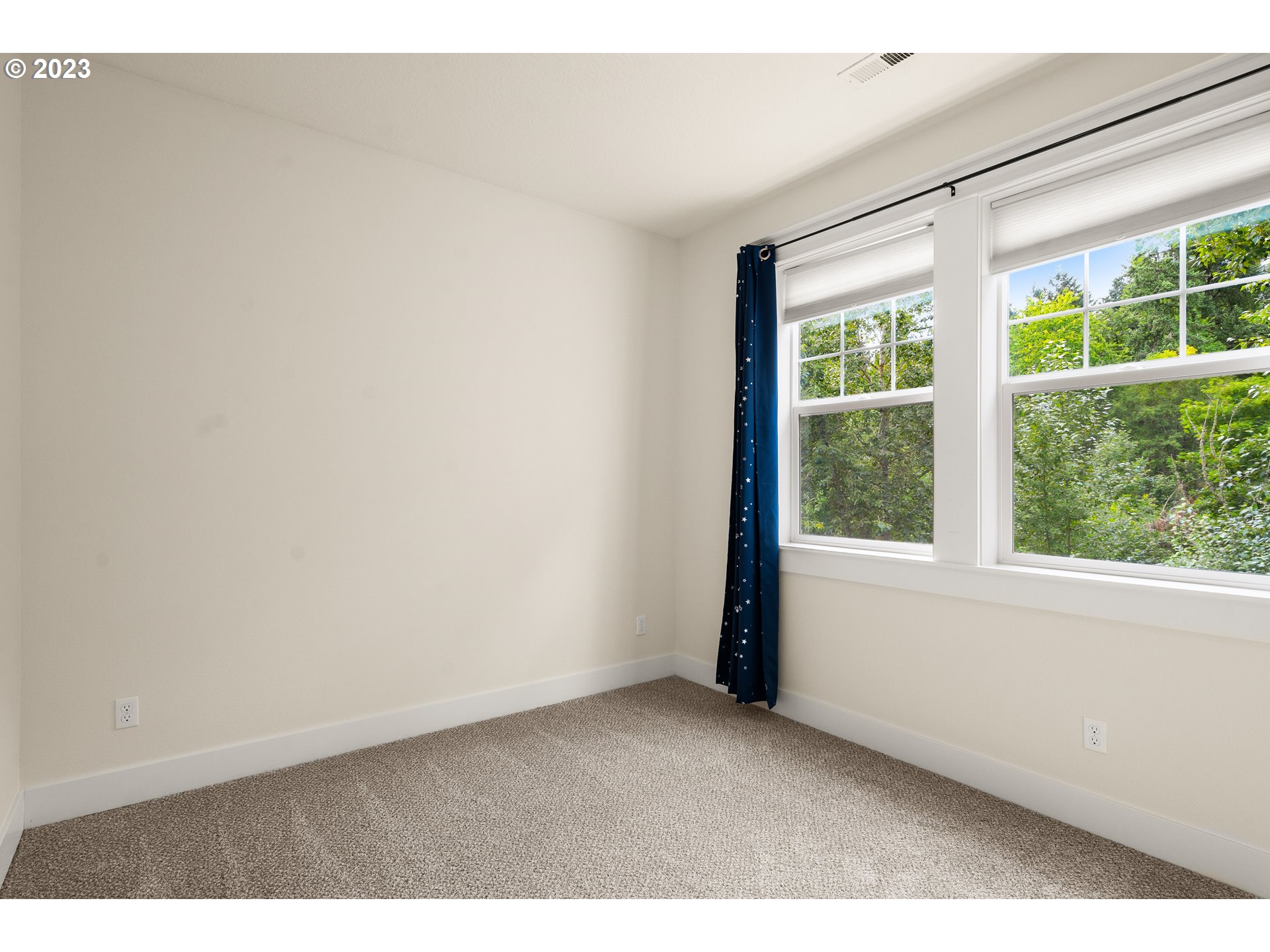 3917 Southwest Stephenson Street Portland, OR 97219 - Photo 23 of 34 a view of an empty room with a window