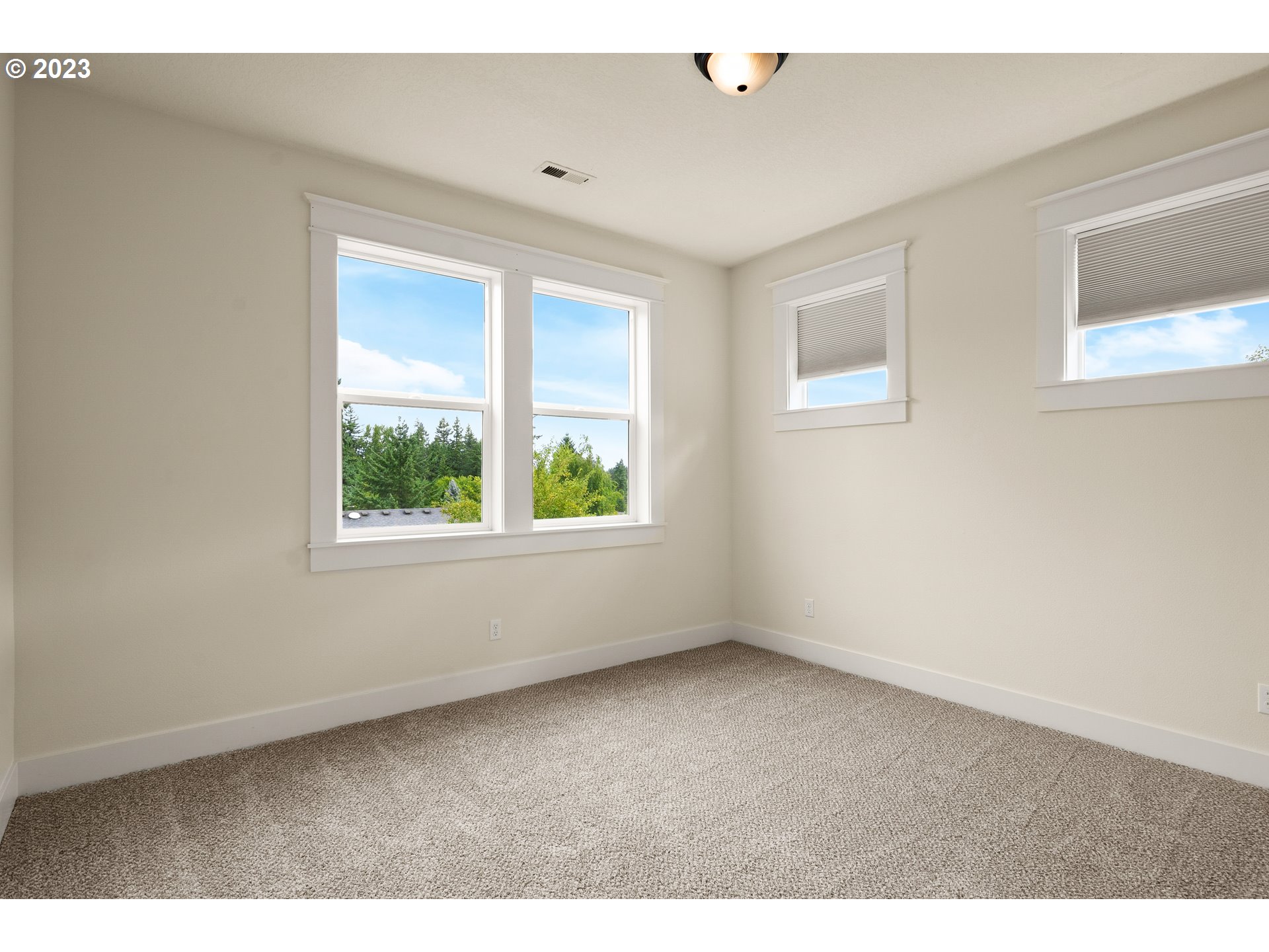 3917 Southwest Stephenson Street Portland, OR 97219 - Photo 25 of 34 a view of an empty room with a window