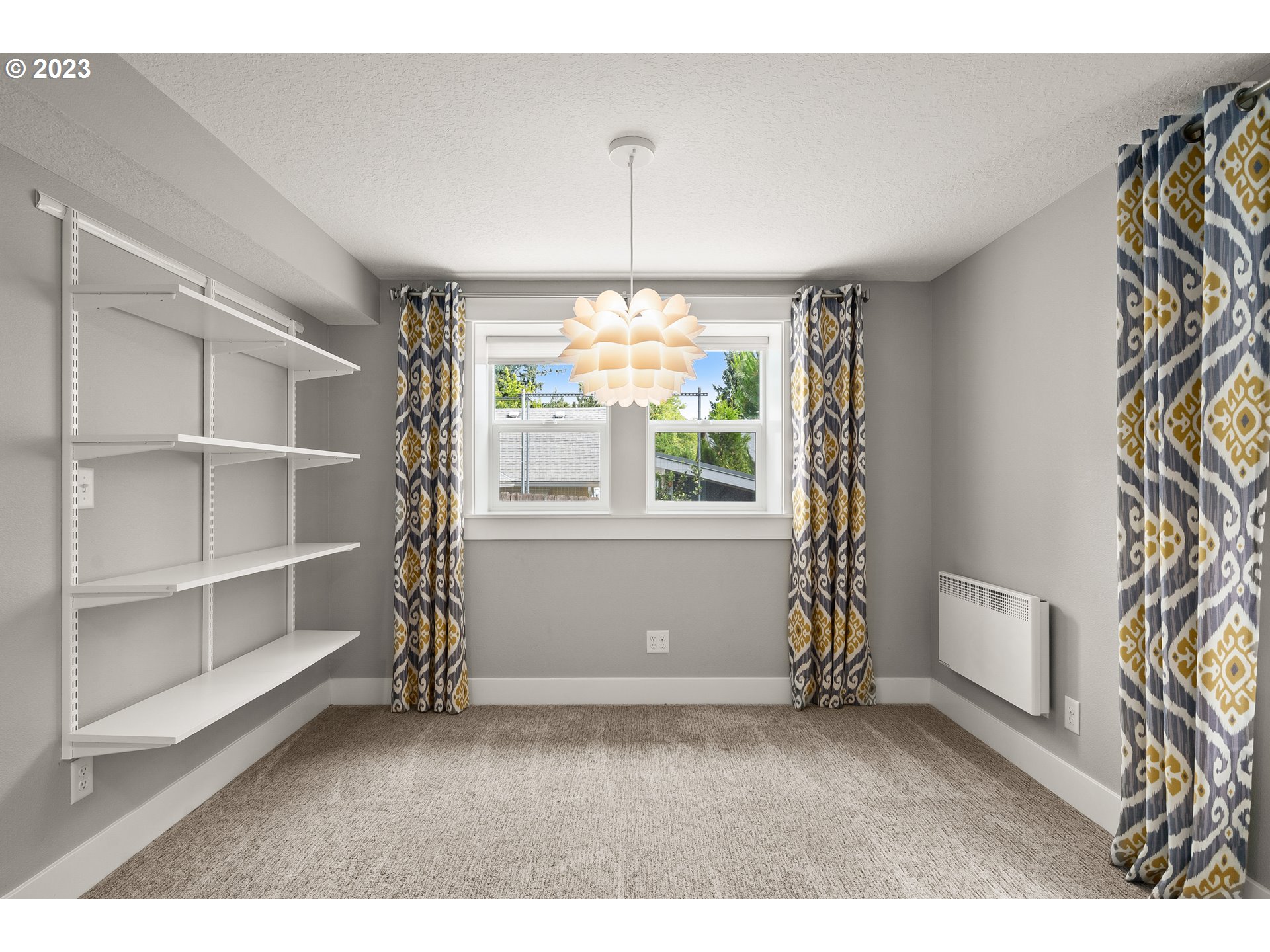 3917 Southwest Stephenson Street Portland, OR 97219 - Photo 29 of 34 a room with window and stairs