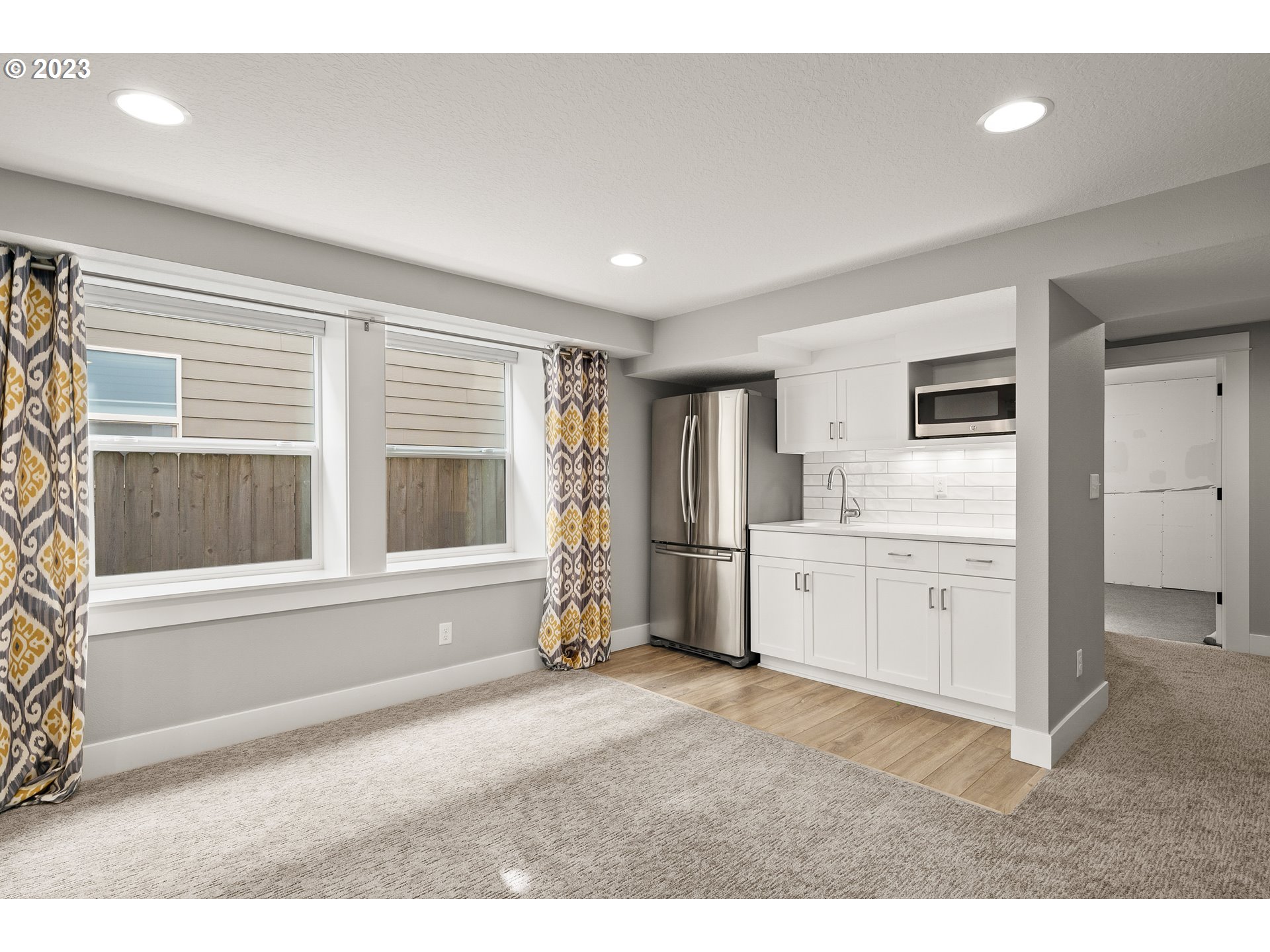 3917 Southwest Stephenson Street Portland, OR 97219 - Photo 30 of 34 a room with a bed and a large window