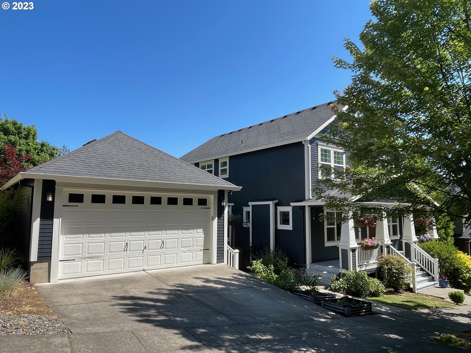 3917 Southwest Stephenson Street Portland, OR 97219 - Photo 3 of 34 a front view of a house with a yard