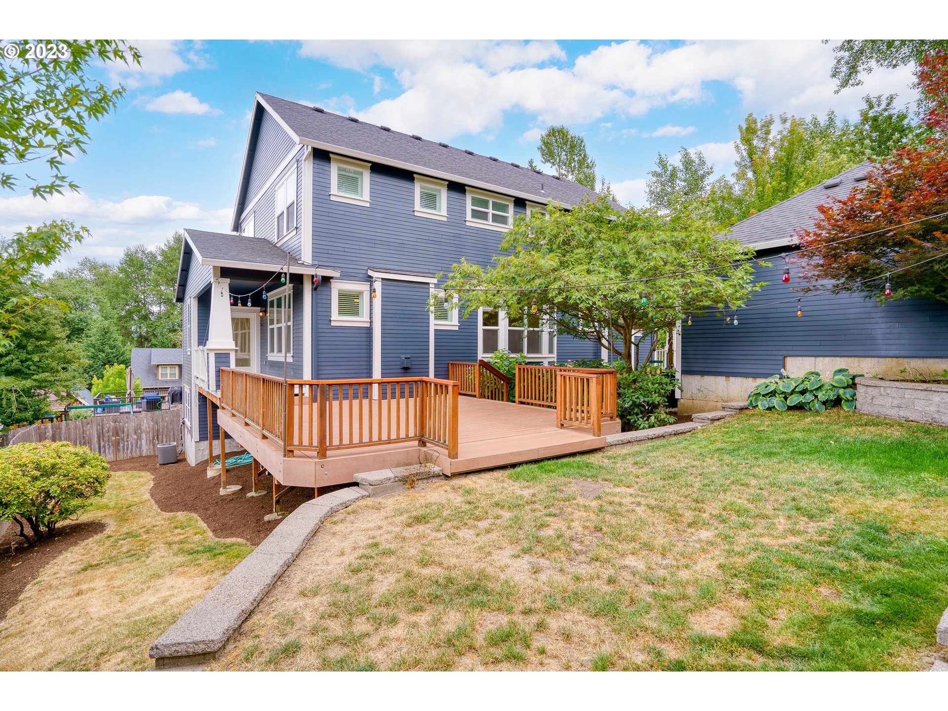 3917 Southwest Stephenson Street Portland, OR 97219 - Photo 33 of 34 a view of a house with a yard