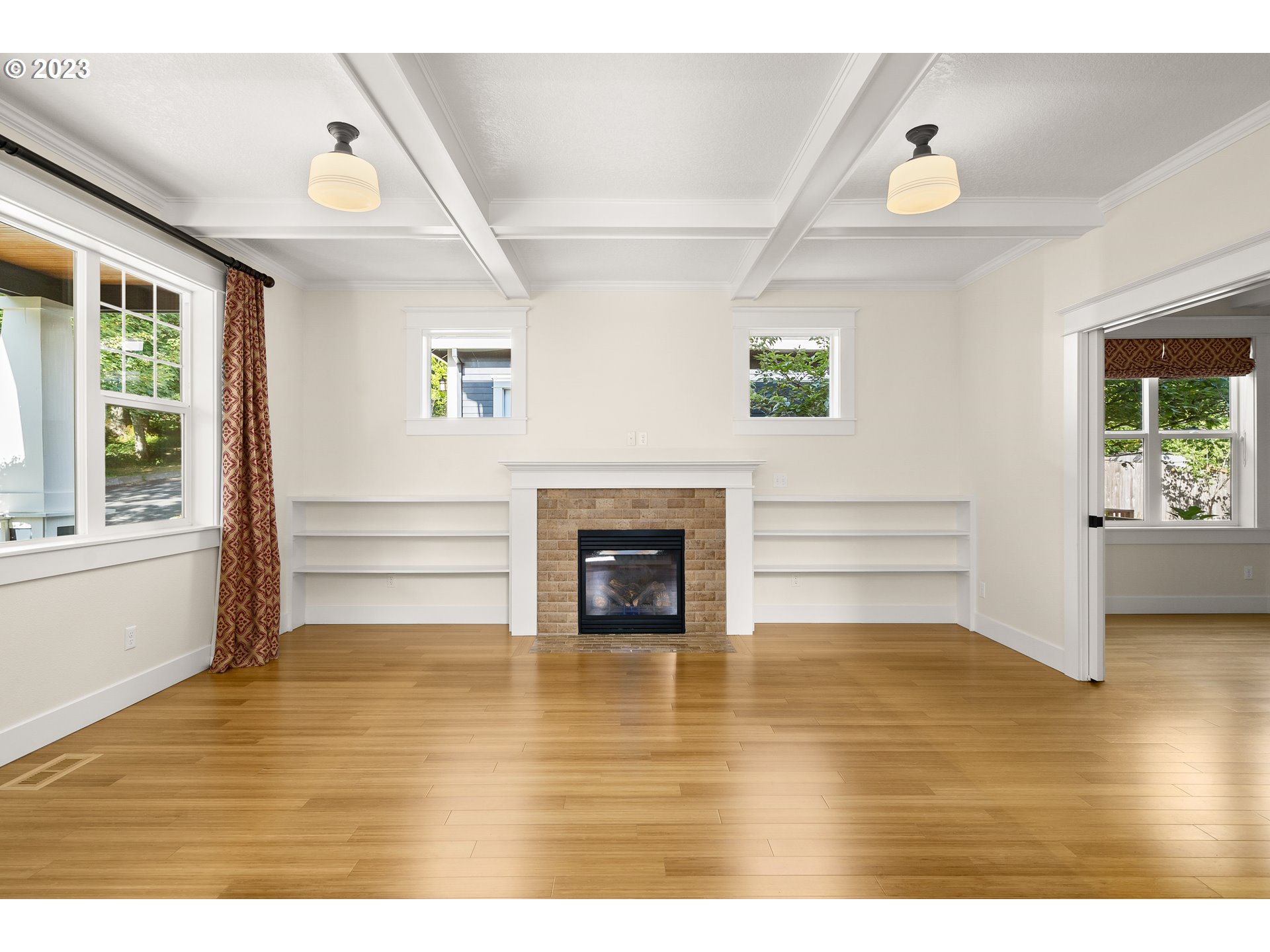 3917 Southwest Stephenson Street Portland, OR 97219 - Photo 7 of 34 a view of livingroom with furniture fireplace and window