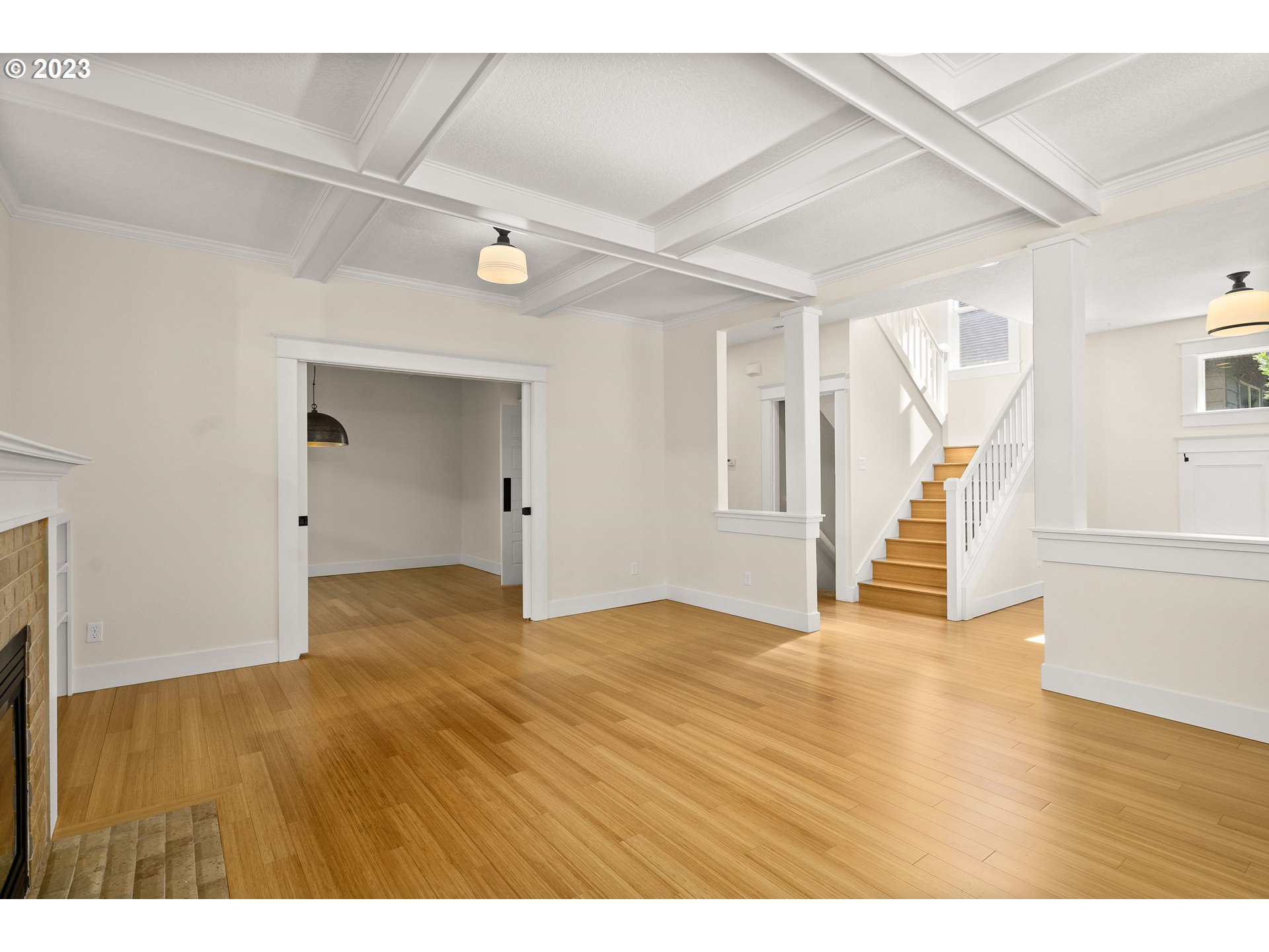 3917 Southwest Stephenson Street Portland, OR 97219 - Photo 9 of 34 a view of an empty room with wooden floor