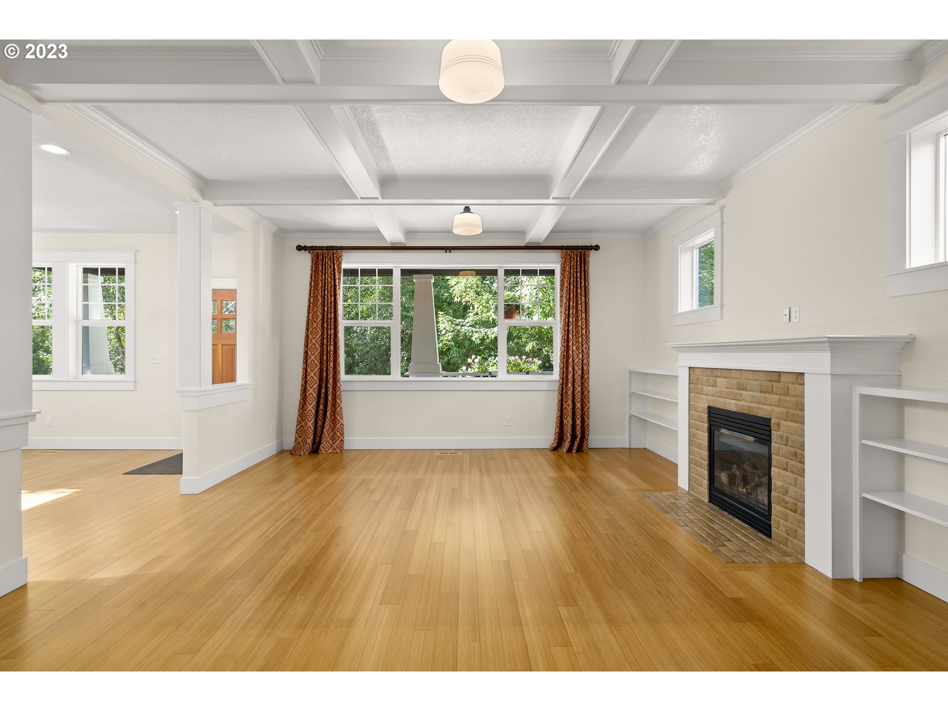 3917 Southwest Stephenson Street Portland, OR 97219 - Photo 10 of 34 a view of an empty room with window and wooden floor