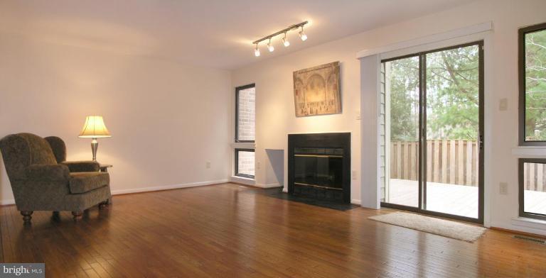 10999 Thrush Ridge Road Reston, VA 20191 - Photo 7 of 24 a living room with furniture and a large window