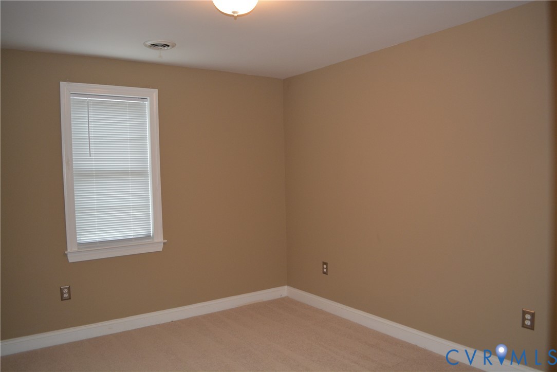 4550 Powhatan Lakes Road Powhatan, VA 23139 - Photo 12 of 17 an empty room with a window