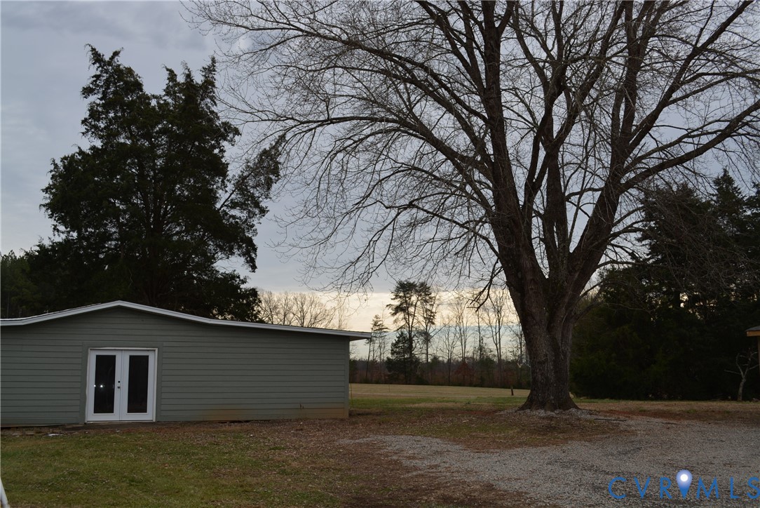 4550 Powhatan Lakes Road Powhatan, VA 23139 - Photo 16 of 17 a backyard of a house with lots of green space