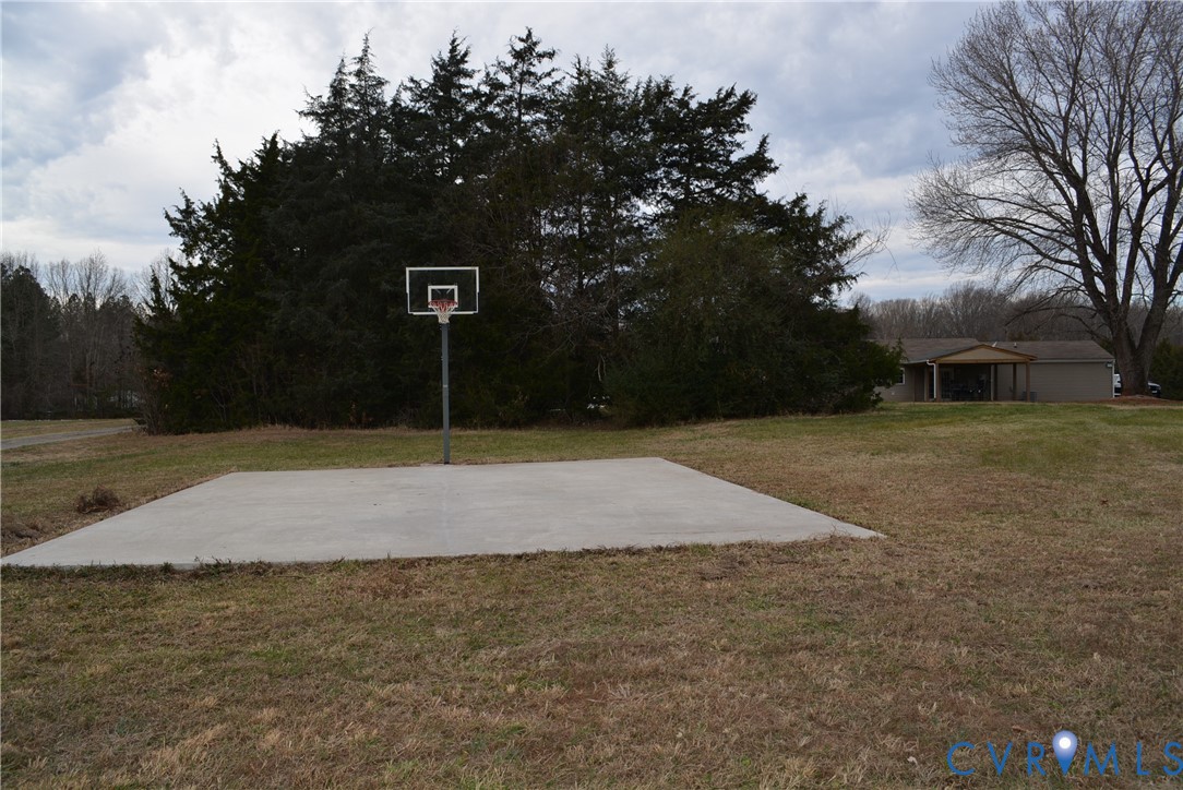 4550 Powhatan Lakes Road Powhatan, VA 23139 - Photo 17 of 17 a swimming pool with trees in the background