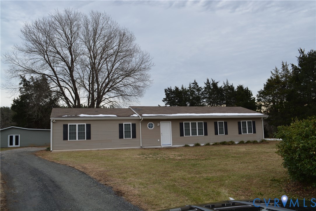 4550 Powhatan Lakes Road Powhatan, VA 23139 - Photo 2 of 17 a front view of a house with a garden