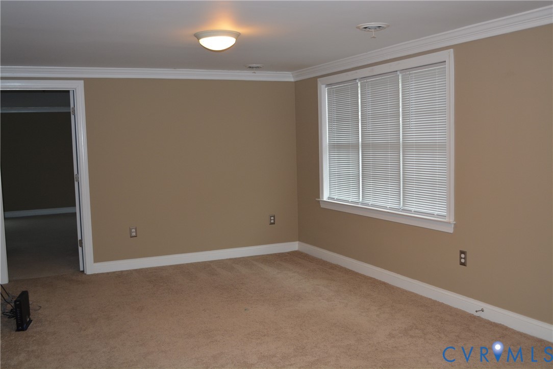 4550 Powhatan Lakes Road Powhatan, VA 23139 - Photo 4 of 17 an empty room with a window