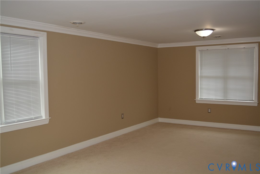 4550 Powhatan Lakes Road Powhatan, VA 23139 - Photo 9 of 17 an empty room with a window