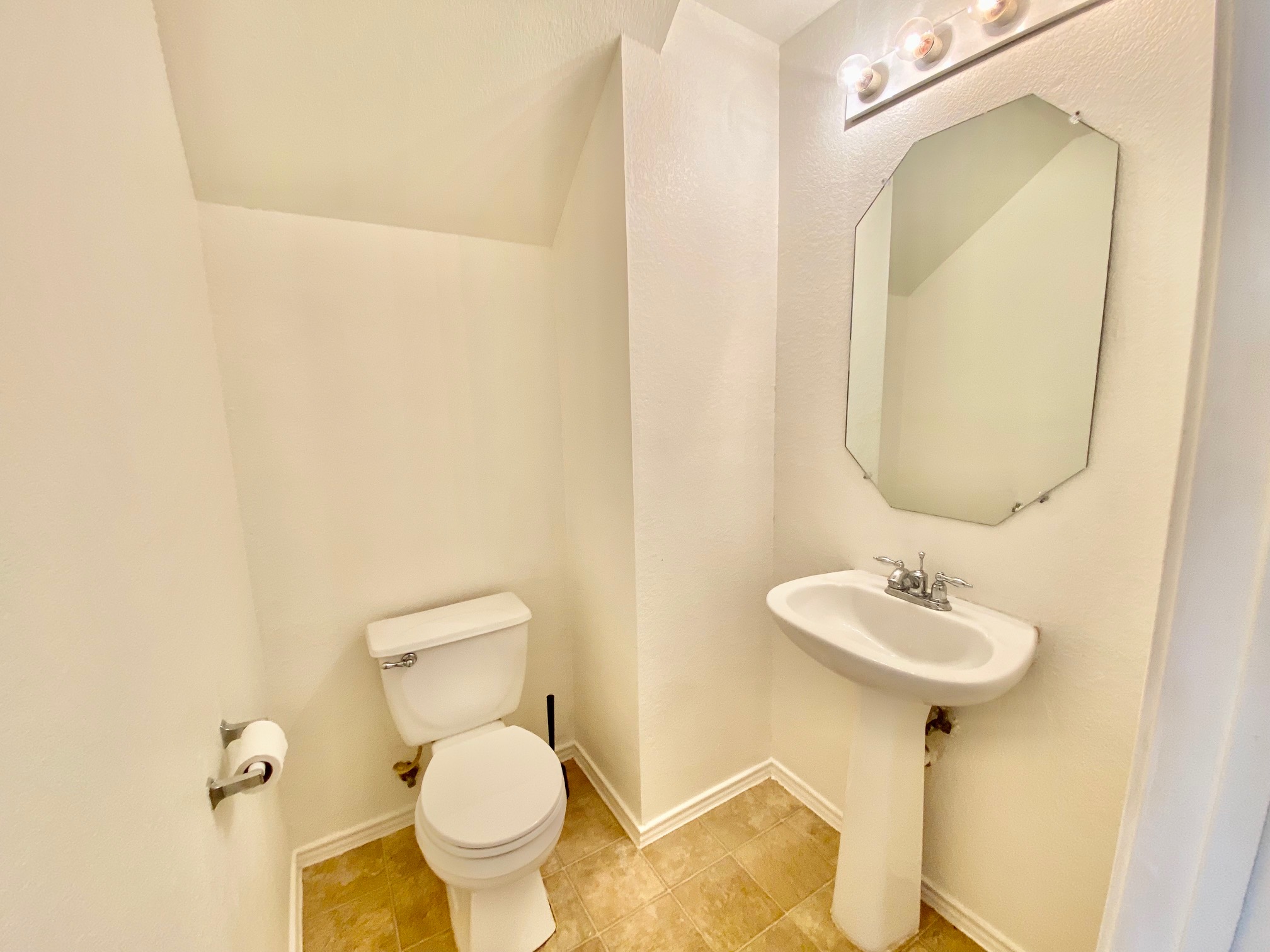 1000 Berry Bend Path Round Rock, TX 78664 - Photo 14 of 20 A well-lit powder room offers functional fixtures and tiled flooring.