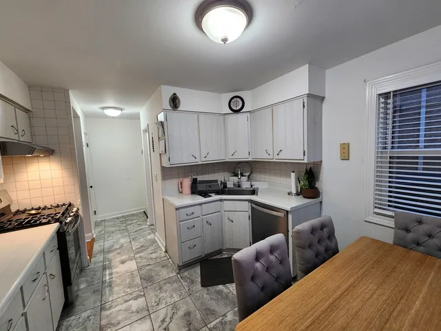 a bathroom with a sink toilet and mirror