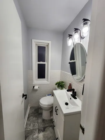 a living room with lots of furniture and a wooden floor