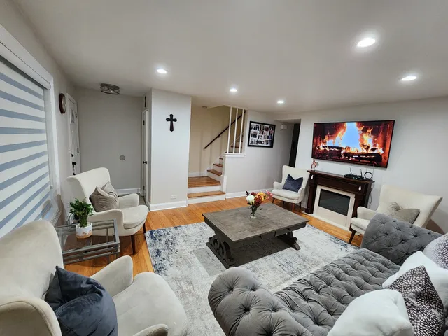 a living room with furniture or couch and a fireplace