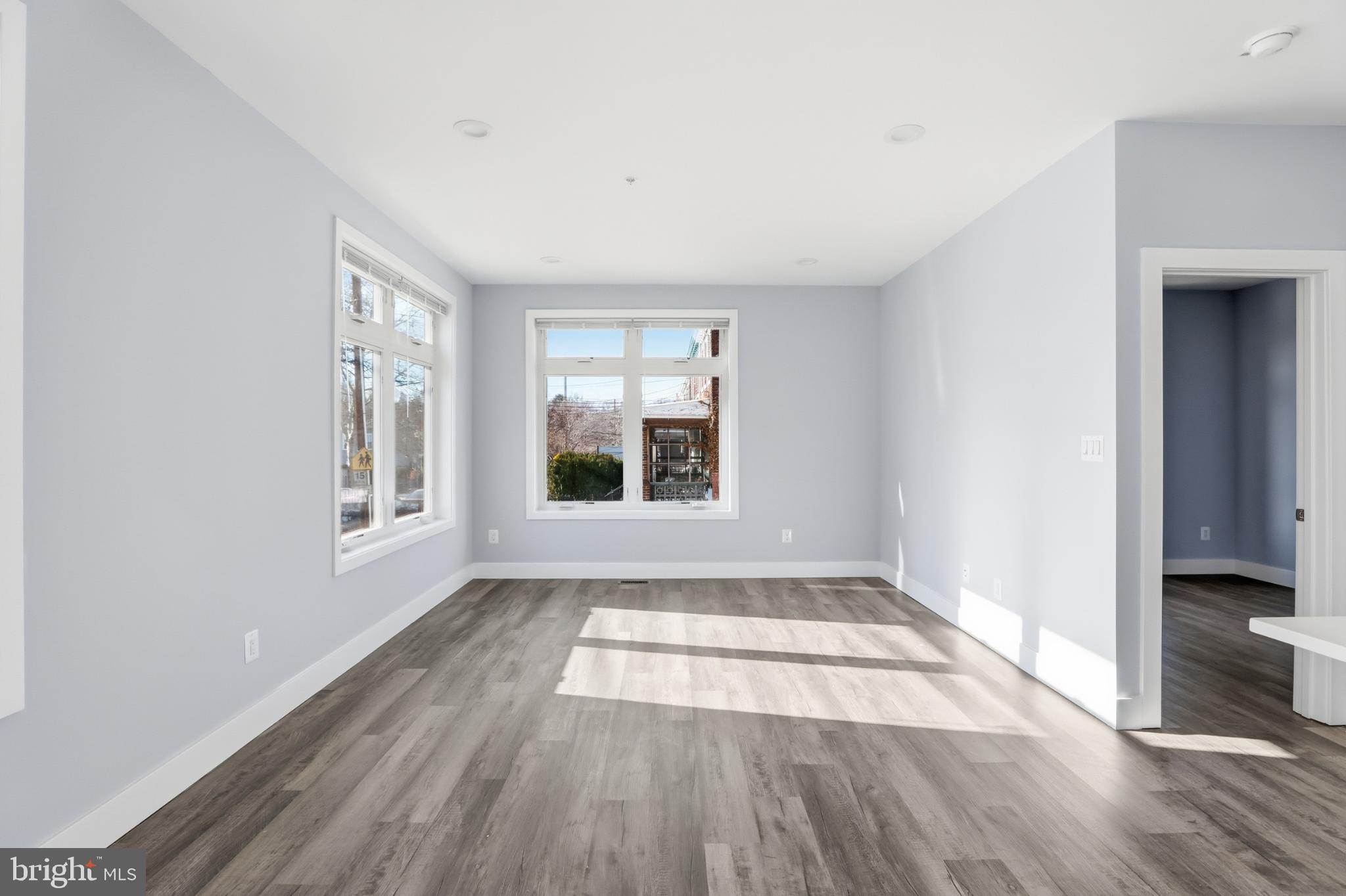 2600 4th Street Northeast, Unit A Washington, DC 20002 - Photo 11 of 33 a view of an empty room with a window and wooden floor