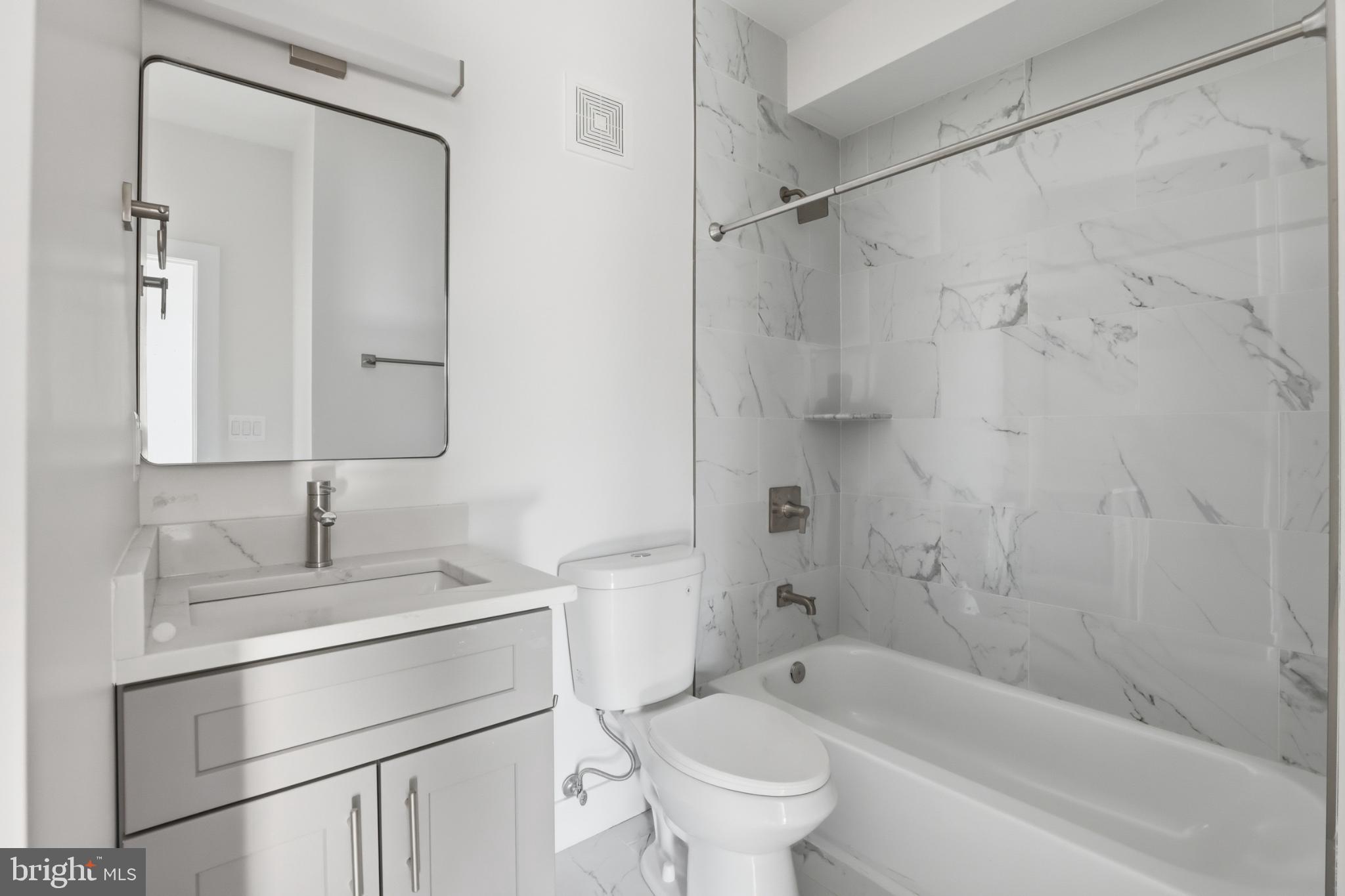2600 4th Street Northeast, Unit A Washington, DC 20002 - Photo 16 of 33 a bathroom with a sink toilet and shower