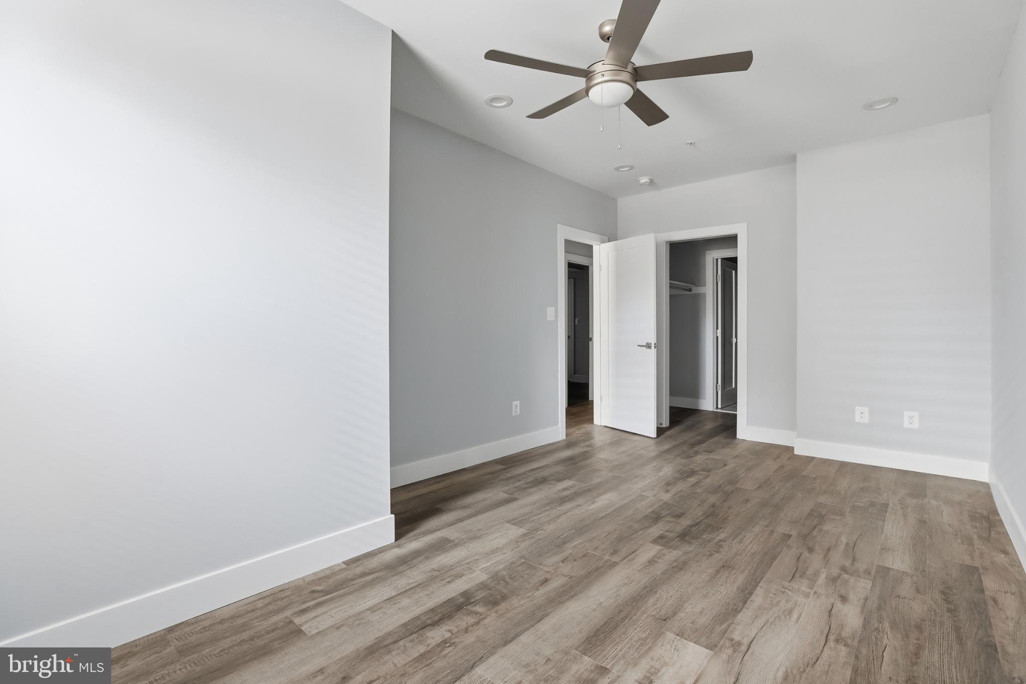 2600 4th Street Northeast, Unit A Washington, DC 20002 - Photo 21 of 33 a view of empty room with wooden floor and ceiling fan
