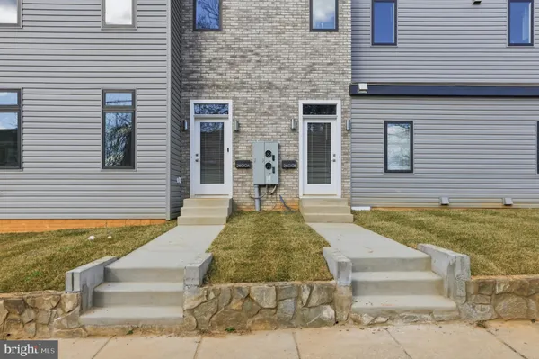 a view of a brick house with many windows