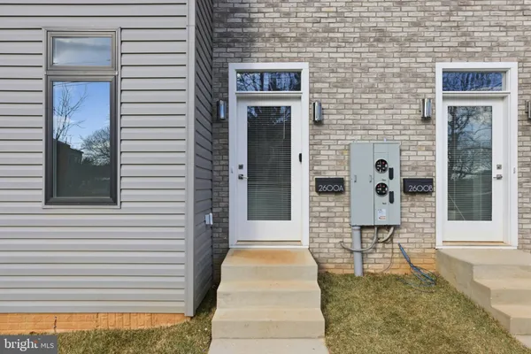 a front view of a house with a door and a window