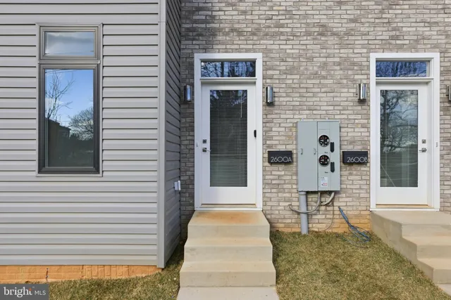 a front view of a house with a door and a window