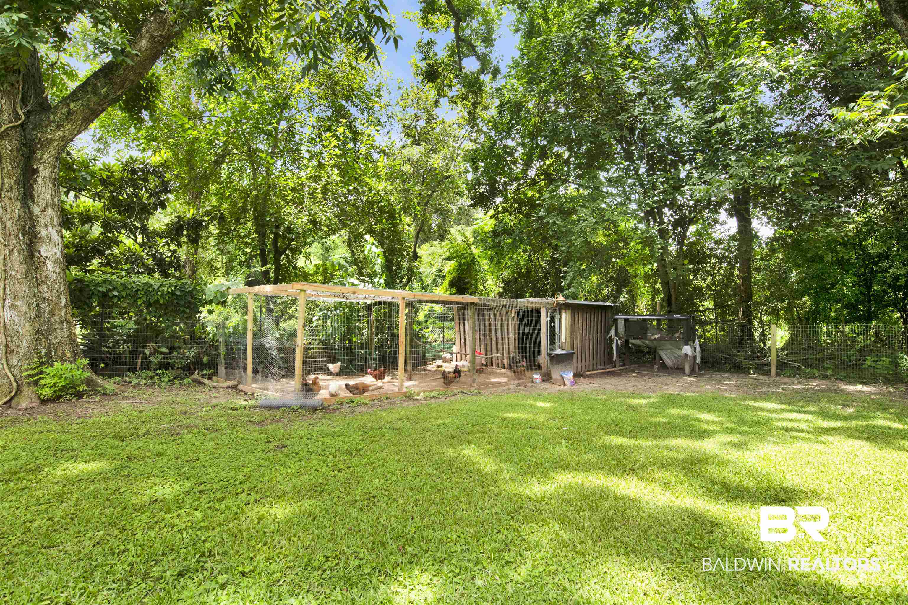 4265 Greaves Road Eight Mile, AL 36613 - Photo 27 of 34 View of green lawn with exterior structure and an outdoor structure