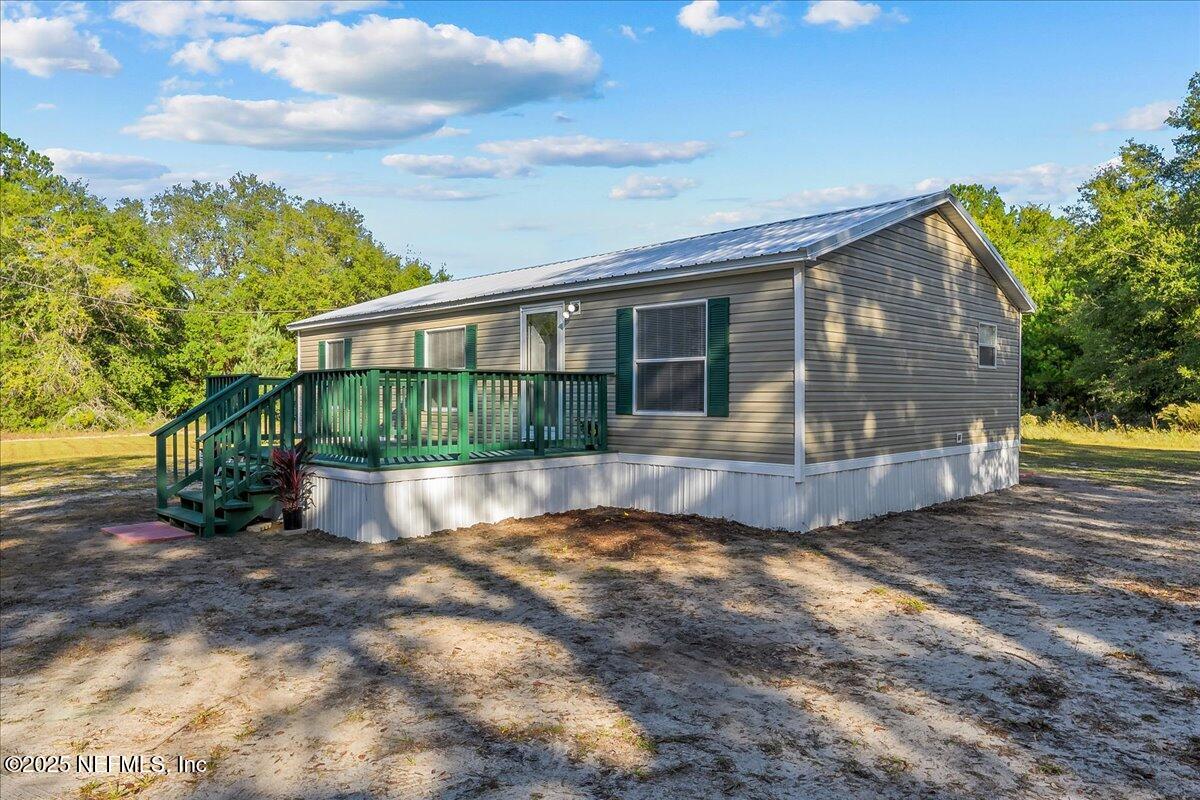 316 Sheila Avenue Interlachen, FL 32148 - Photo 3 of 22 a view of house with backyard and garden