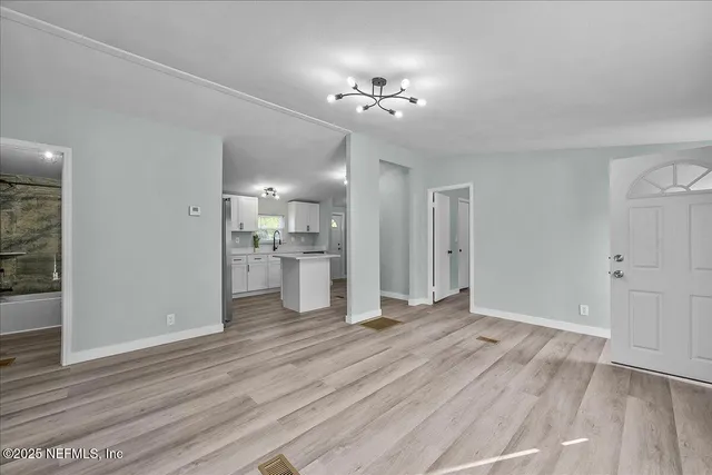 a view of a livingroom with a kitchen