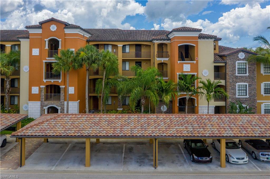 9715 Acqua Court, Unit 136 Naples, FL 34113 - Photo 23 of 24 a backyard of a house with seating space