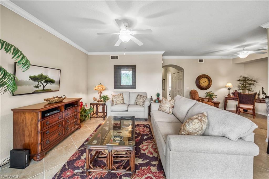 9715 Acqua Court, Unit 136 Naples, FL 34113 - Photo 4 of 24 a living room with furniture and wooden floor