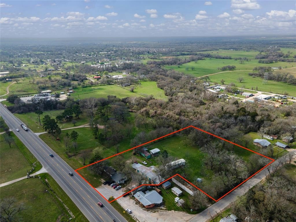 566 State Highway 95 Bastrop, TX 78602 - Photo 1 of 32 a view of a garden from a balcony