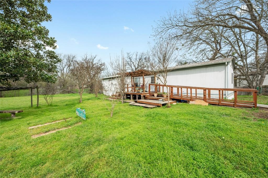 566 State Highway 95 Bastrop, TX 78602 - Photo 16 of 32 a view of a park with swings and slides