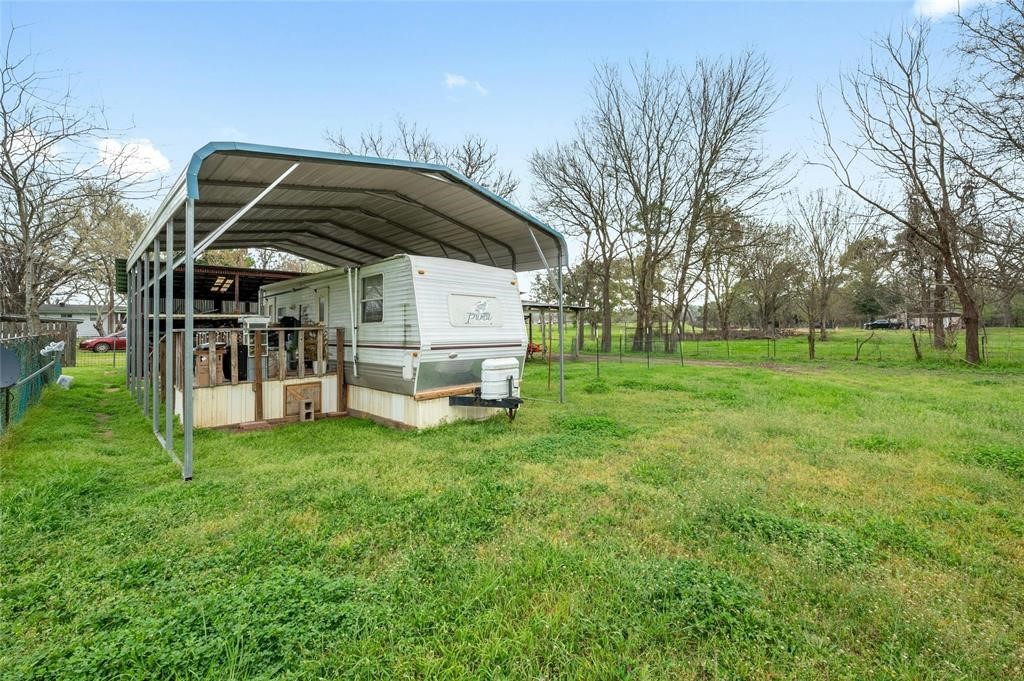 566 State Highway 95 Bastrop, TX 78602 - Photo 22 of 32 a view of a house with backyard