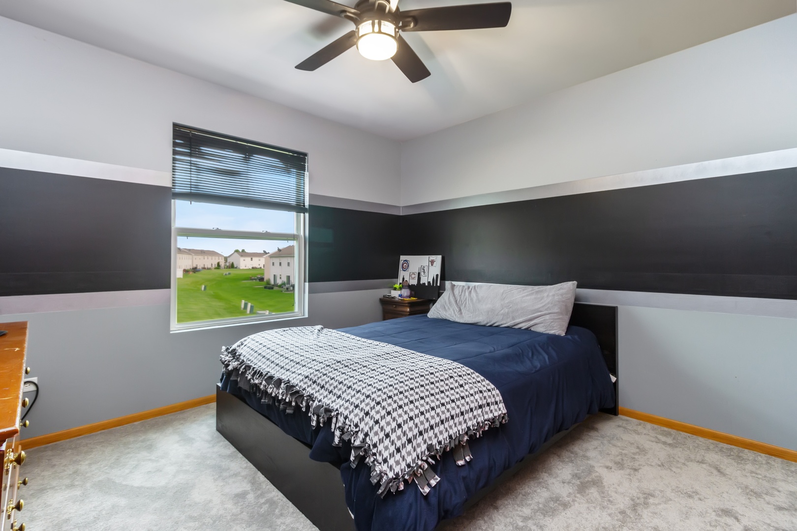 25130 Faraday Road Manhattan, IL 60442 - Photo 12 of 15 a bedroom with a bed and a chandelier