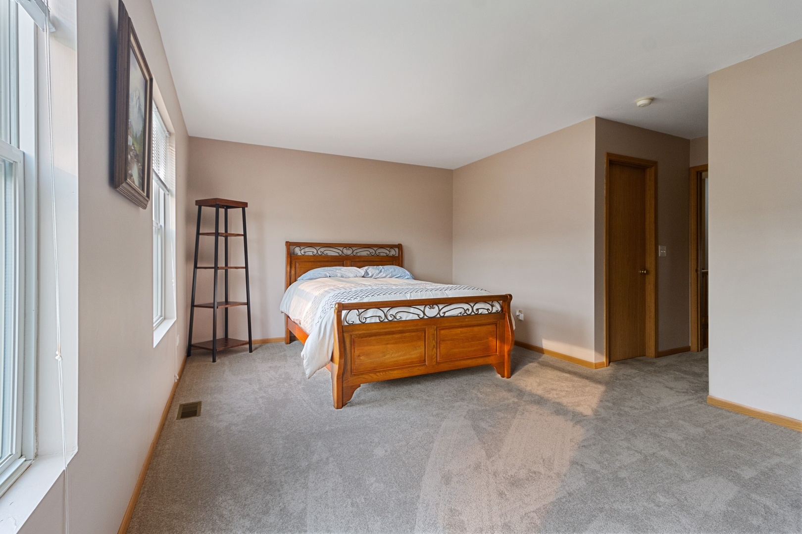 25130 Faraday Road Manhattan, IL 60442 - Photo 8 of 15 a bedroom with a bed and a cabinets