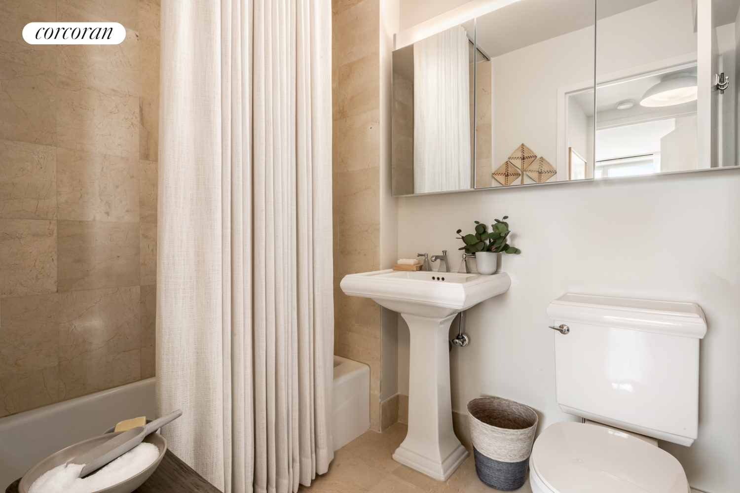 20 River Terrace, Unit 20D Manhattan, NY 10282 - Photo 6 of 10 a bathroom with a sink toilet and shower