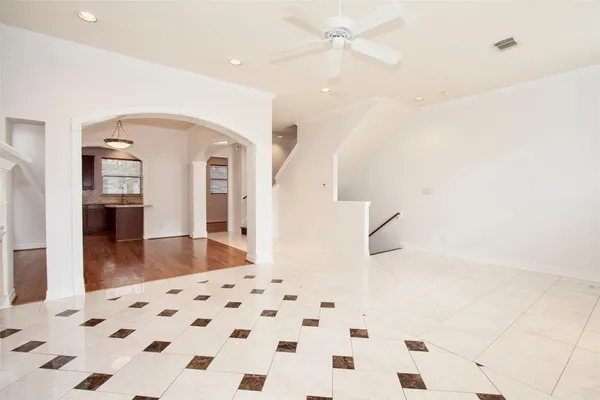 a view of a hallway with a black white checkered floor