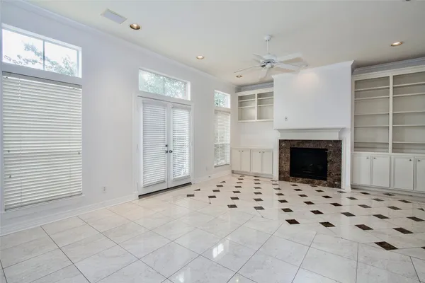 a view of an empty room with a fireplace