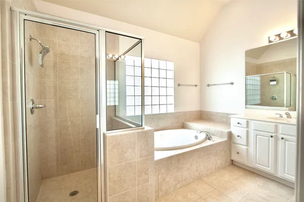 a bathroom with a bathtub and a sink