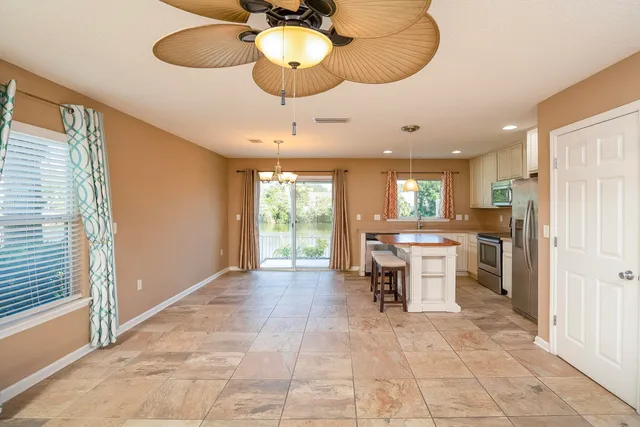 a view of a kitchen and dining room