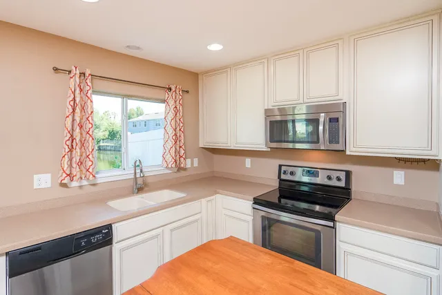 a kitchen with a sink and a window